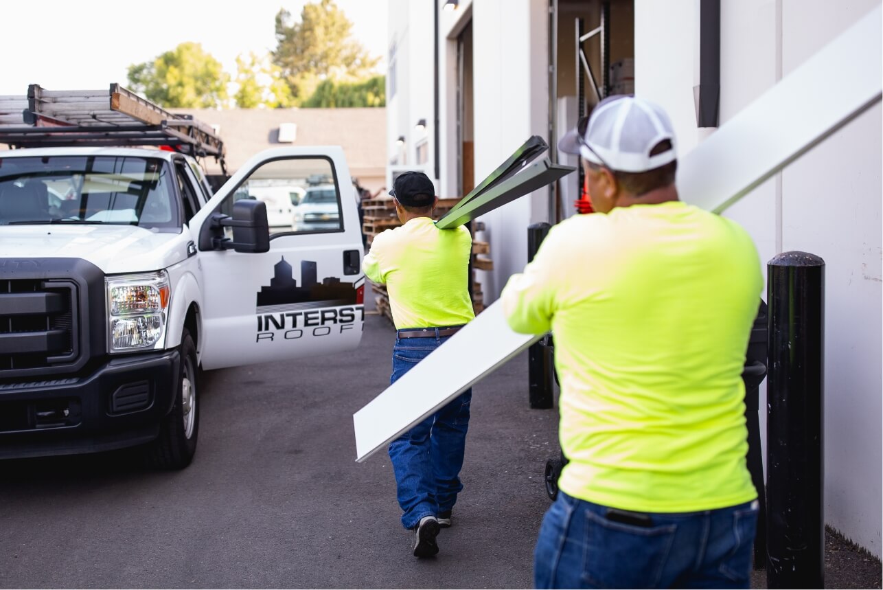 Roofing Contractors Loading Material